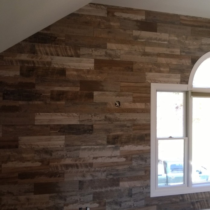 - Wood-look ceramic tile as accent wall in master bedroom.
