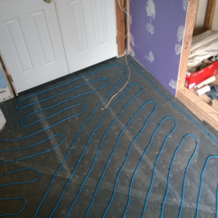 - Electric radiant heating installed prior to a wet-bed floor with ceramic tile.
